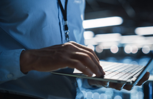 Man typing on laptop