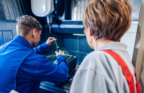 Apprentice Being Supervised Using Machinery