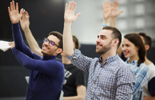 Students with hands in the air