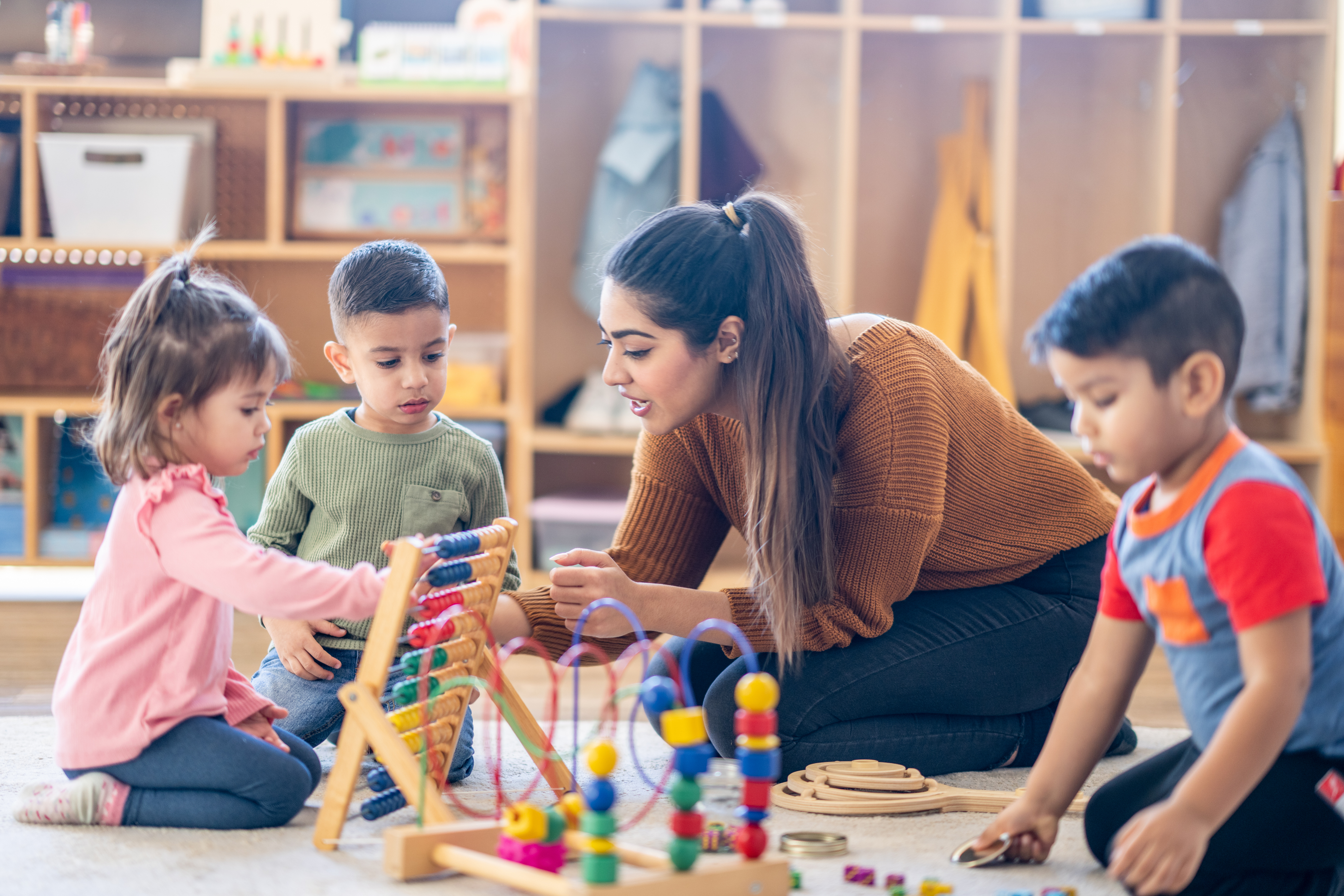 Children And Staff Playing