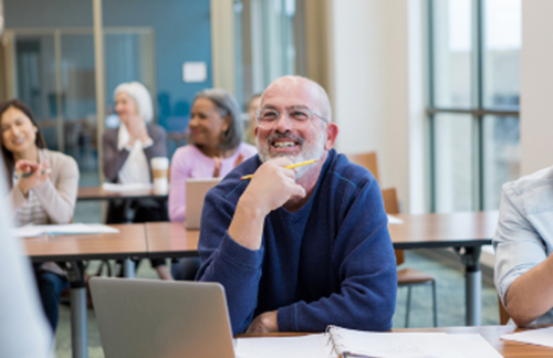 Man Smiling In Classroom