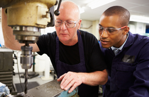 Teacher And Student Using Drill