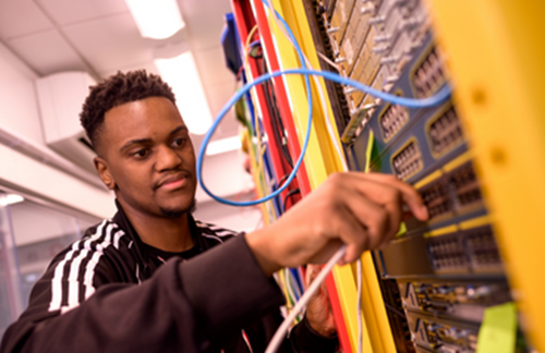 Young Man Working On Computer Network Infrastructure