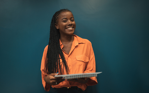 Smiling Woman In Orange Shirt